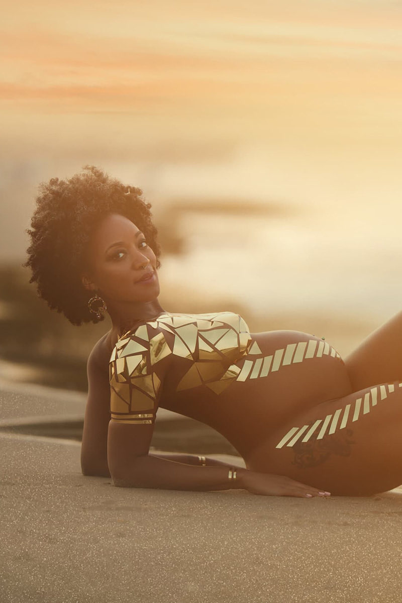 Pregnant woman in a patterned outfit during an Evanston beach maternity photo session