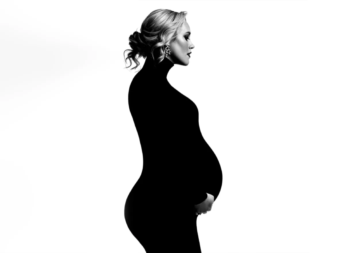 Black-and-white fine-art pregnancy portrait in a Chicago studio